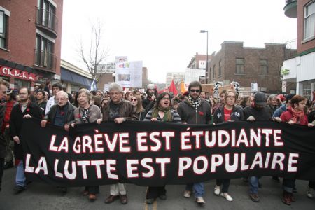 Students and supporters march through downtown Montreal. These marches may be fewer and far between once a new emergency law in adopted. Image via La Riposte on Flickr.