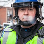 Local Police officers are on hand to support Riot Police during Montreal's 18th annual Protest against Police Brutality.