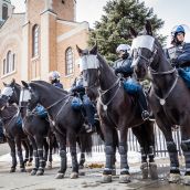Riot Police on horses are called in the during Montreal's 18th annual Protest against Police Brutality.