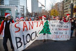 A group of UQÀM students dressed up in santa costumes and called themselves the Santa Block, protesting Christmas as a consumerist holiday and mocking the new law criminalizing wearing masks at an 'illegal' demonstration. (Robin Dianoux)