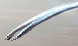 Airplane dispensing stratospheric aerosols in atmosphere.