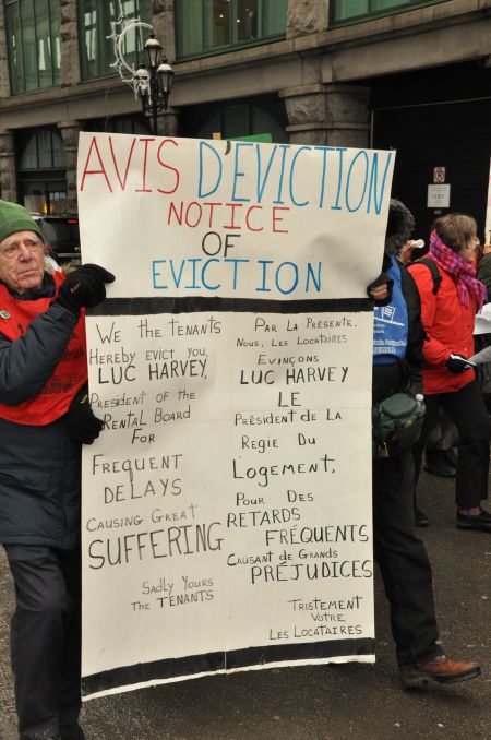 Protesters deliver an "eviction notice" to Quebec's rental board to highlight the drastic rise in waiting times for tenants' complaints filed with the organization. PHOTO: Project Genesis.