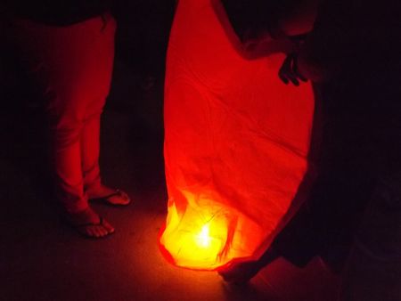 Protesters preparing a sky lantern to be released in the memory of the Palestinian victims   - July 25 Night Vigil