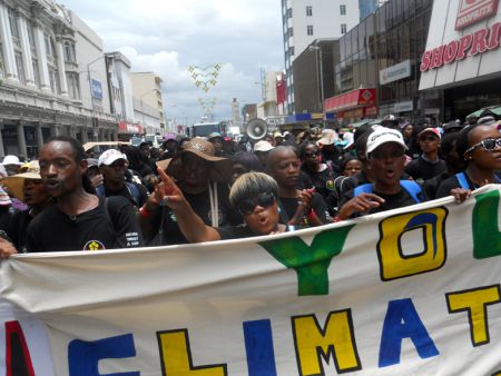 Over 10,000 people took to the street to call on governments to do more to reach a deal to curb global warming.