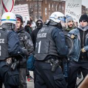 Tension mounts as protesters and police face-off during Montreal's 18th annual Protest against Police Brutality.