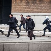 Montreal Riot Police chase protesters during Montreal's 18th annual Protest against Police Brutality.