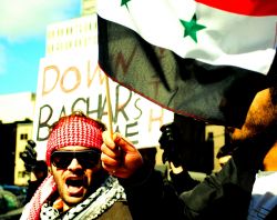 Syrian-Montrealers demonstrate in the city's streets in opposition to the Assad regime. Photo: Freedomania (via Flickr)