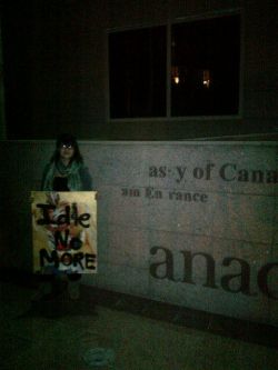 Patricia Stein @PygmySioux with #IdleNoMore poster in front of the Canadian Embassy in Cairo, Egypt